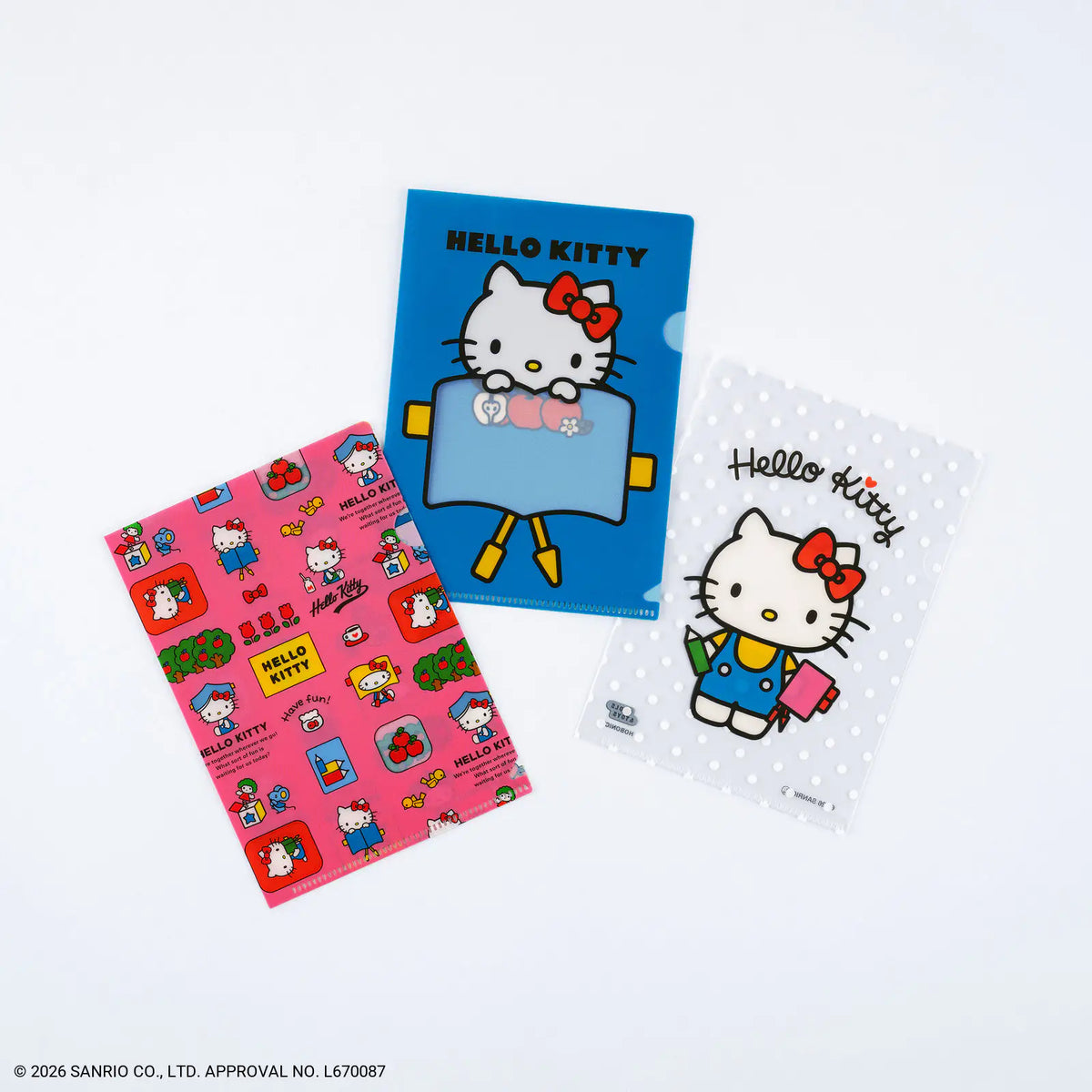 Three Hello Kitty themed plastic file folders on a clean white background. One folder is bright blue with a large Hello Kitty illustration, one is pink with a repeating character pattern, and one is white with a polka-dot background and a smaller Hello Kitty character print.